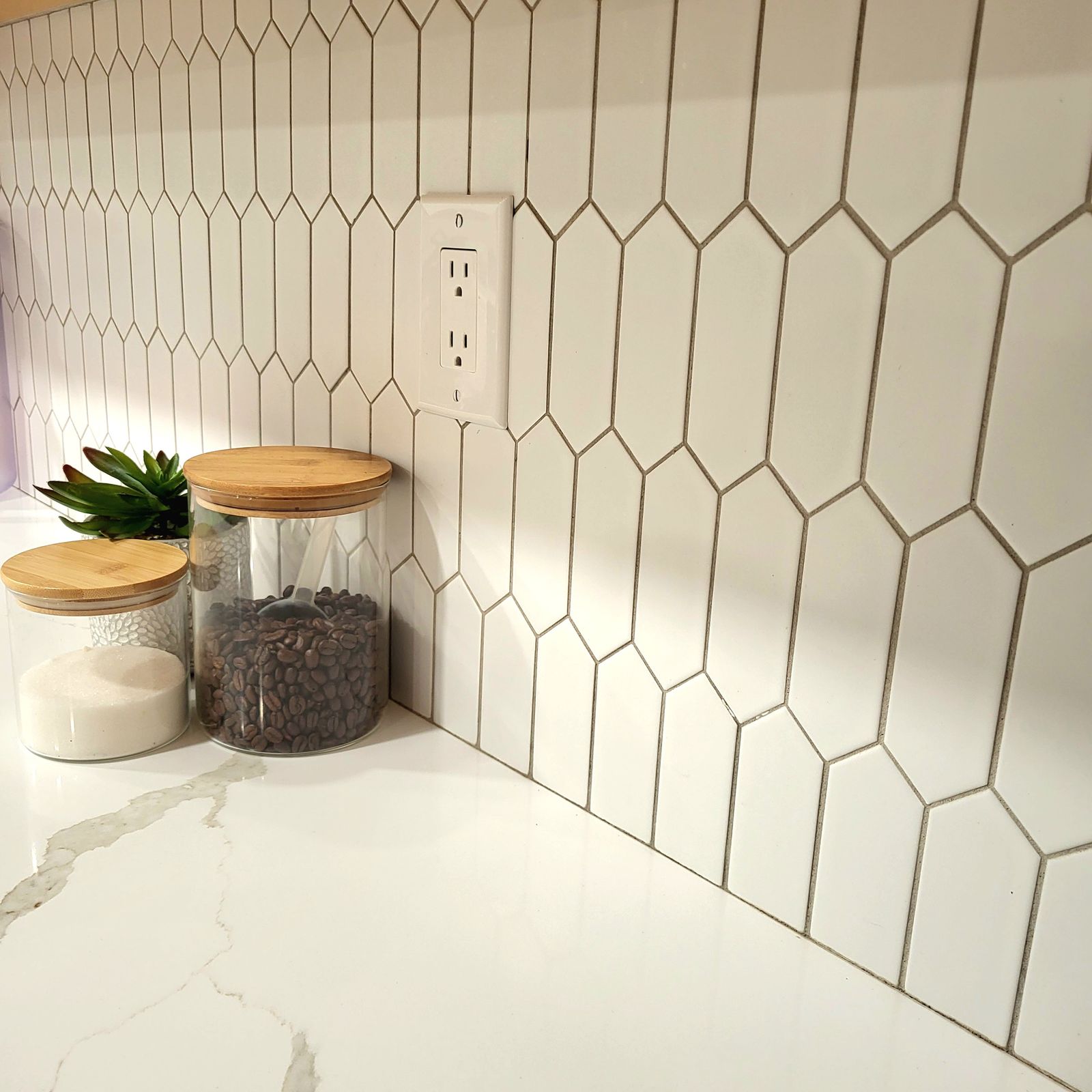White picket tile backsplash over a quartz countertop