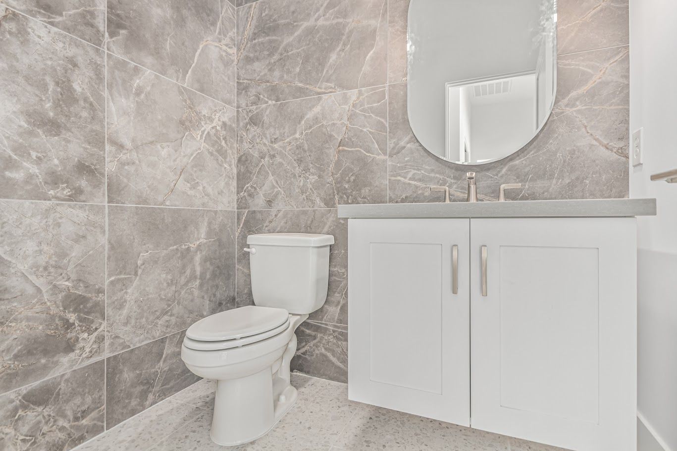 Bathroom with large gray porcelain wall tile